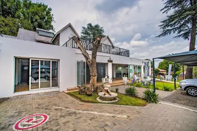 a house with a no parking sign in front of it at Khayalami Hotel - Ermelo in Ermelo