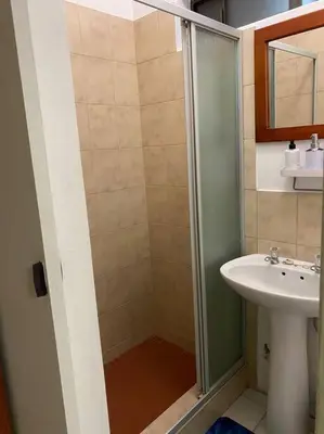 a bathroom with a shower and a sink at The Royal Nest in Sandown