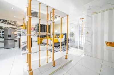 a room with a yellow bed in the middle at Homes of Ace Diamond in Pretoria