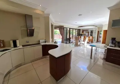 a large kitchen with a counter top in a room at 10 Pecanwood Dr 4 Bedroom Beauty in Hartbeespoort