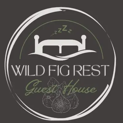 a logo for a wild fire rest guest house at Wild Fig Rest Guest House in Polokwane