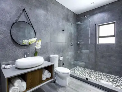 a bathroom with a sink and a toilet and a shower at Panorama Villa in Graskop