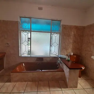 a bath tub in a bathroom with a window at 38 On Andrew Street in Sabie