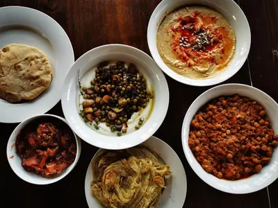 a group of bowls of food on a table at Mbizi Bush Lodge in Grietjie Nature Reserve