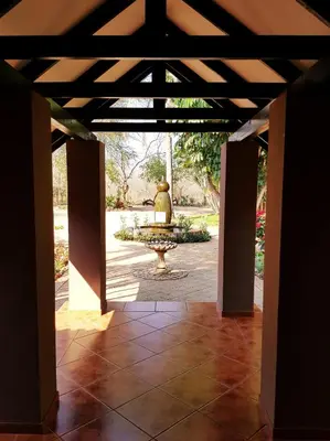 a view of a fountain from the inside of a building at Barnstormers Rest in Malelane