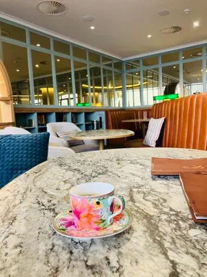 a coffee cup sitting on a table with a plate at Thango Res in Johannesburg
