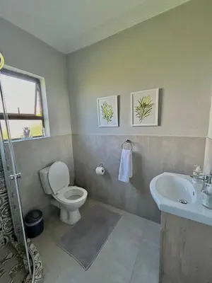 a bathroom with a toilet and a sink at The Comfy Corner @ Skyfall Country Estate in Polokwane