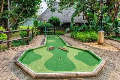 a miniature golf course in front of a house at Kruger Park Lodge Unit No. 216 in Hazyview