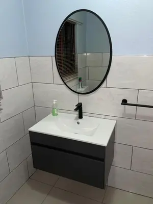 a bathroom with a sink and a mirror at Pendleberry Grove Unit 51 in Bela-Bela