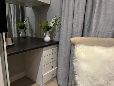 a bedroom with a desk with a chair and a mirror at 337 Justice Mahomed Guest House in Pretoria