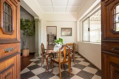 a dining room with a table and chairs at House Falcon in Pretoria