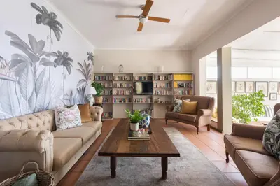 a living room with a couch and a table at House Falcon in Pretoria