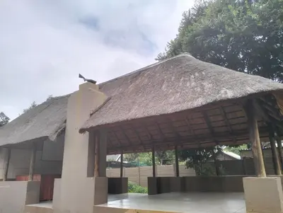 a pavilion with a thatched roof on a building at O&S BnB in Centurion