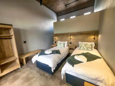 a bedroom with two beds in a room at Bluebell House@799 in Dullstroom