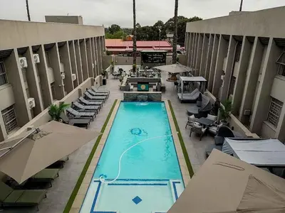 an overhead view of a swimming pool at a hotel at Q's Evander Hotel & Apartments in Evander