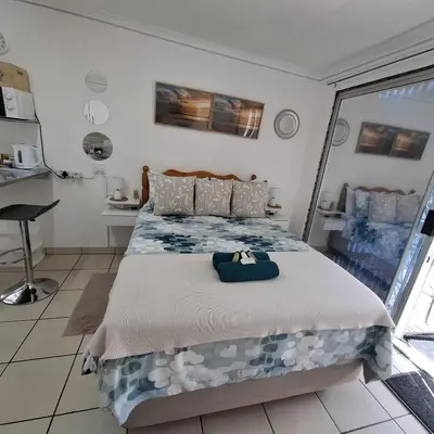 a bedroom with a large bed in a room at Sleep Haven Self-Catering Accommodation - Nelspruit in Nelspruit