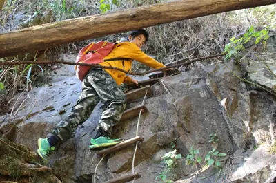a boy walking over a bridge on a trail at Magoebaskloof Getaway in Magoebaskloof