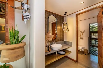a bathroom with a sink and a mirror at Marula Sunrise Lodge, Mjejane Private Game Reserve in Hectorspruit