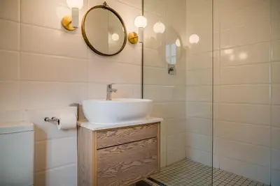 a bathroom with a sink and a mirror at The Lofts @ Maple Square in Dullstroom