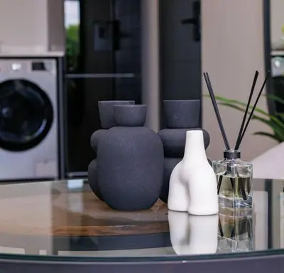 a group of vases sitting on top of a table at Luminant Escapes -With Power Backup in Midrand