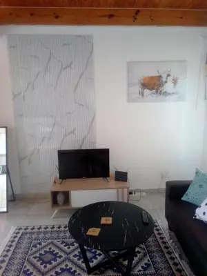 a living room with a couch and a table at Anglerfish in Centurion