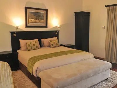 a bedroom with a large bed in a room at 2Ten Hotel in Sibasa