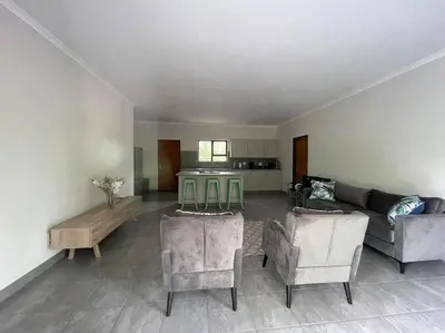 a living room with a couch and a table at 2998 on Olifant in Marloth Park