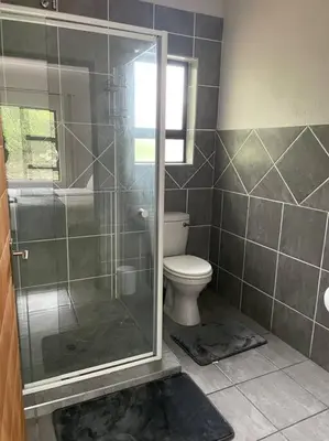 a bathroom with a shower and a toilet at 2998 on Olifant in Marloth Park