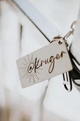 a tag with the word opener hanging on a string at @Kruger in White River