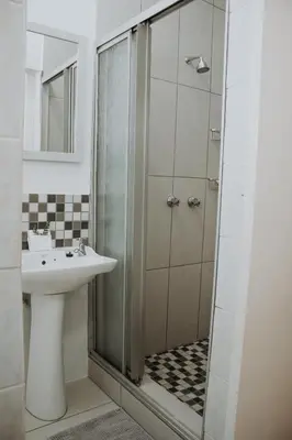 a bathroom with a sink and a shower at @Kruger in White River