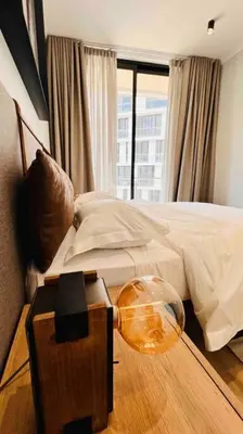 a bedroom with a bed and a bowl on the floor at Newton’s Place - Luxury styled 2 BD Apartment in Midrand