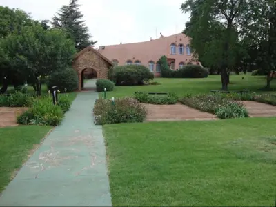 a walkway in front of a large building at Gateway Guesthouse in Benoni
