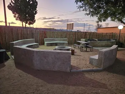 a group of concrete benches in a park at Pietersburg Lodge in Polokwane