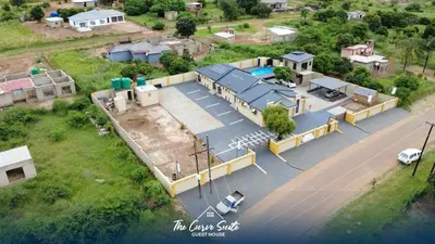 an aerial view of a house next to the water at The Curve Suite Guest House in Nkowakowa