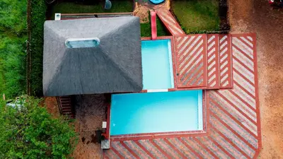 an overhead view of two swimming pools on a roof at Falcon Lodge Bela Bela in Bela-Bela