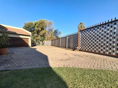 a fence in front of a house at OR Tambo Stay Unit 1 in Boksburg