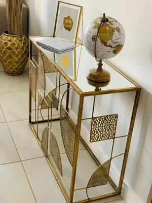 a gold and white shelf with a globe on it at Luxury Holiday Homes - The Blyde in Pretoria