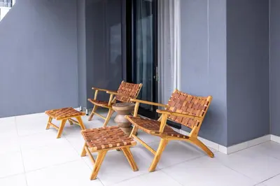 a group of chairs sitting on a balcony at The Cassini Diamond @ Ellipse Waterfall in Midrand