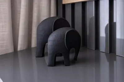 two black elephant figurines sitting on a floor at The Cassini Diamond @ Ellipse Waterfall in Midrand