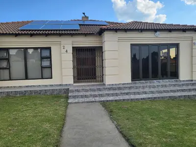 a house with solar panels on the roof at M & N Guest House in Ermelo