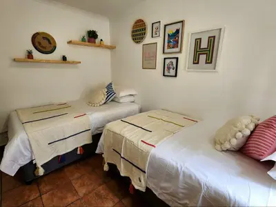 a room with two beds in a room at Baruch in Pretoria