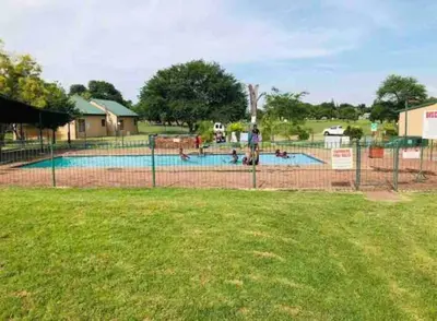 a group of people in a swimming pool at Pendleberry Grove Unit 36 in Bela-Bela