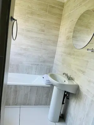 a bathroom with a sink and a bath tub at Pendleberry Grove Unit 36 in Bela-Bela