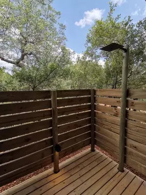 a wooden fence with an umbrella on top of it at Corkwood Villa in Hoedspruit