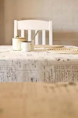 two coffee cups on a table with a white chair at Pumpkin Tree Guesthouse in Middelburg
