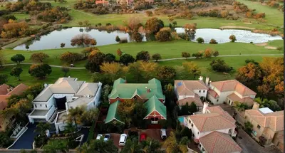 an aerial view of a house with a pond at The Woodpecker Inn in Pretoria