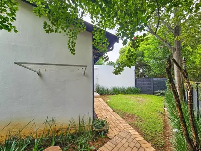 a side view of a white wall with a walkway at Micro Urban Oasis 2 in Pretoria