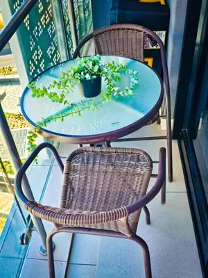 a table with a potted plant on a patio at Luxurious, affordable Ellipse apartment in Midrand