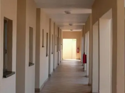 an empty hallway of an office building with a long corridor at DZUVHA VILLAGE INN in Thohoyandou