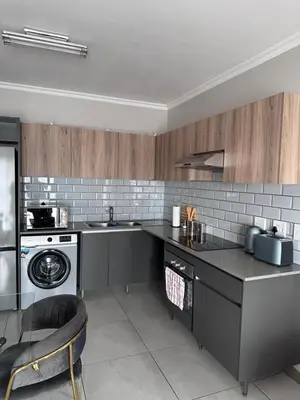 a kitchen with a sink and a dishwasher at Secure 1 Bedroom Apartment in Midrand, Waterfall City - Lock Up and Go - Free WIFI and Parking - 9 Elizabeth Place in Midrand